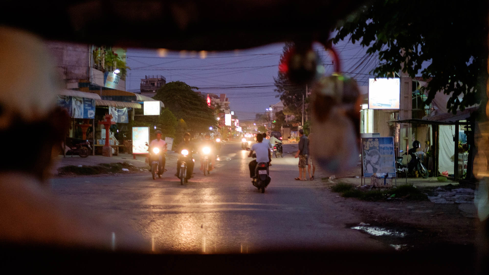 Tuktuk driver on the streets of Battambang at night - Cambodia