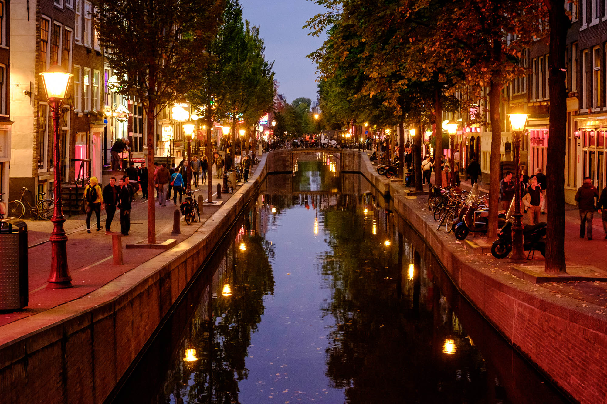 Town canal at night with lights on in Amsterdam